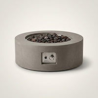 Brookhurst 43 In. W X 13 In. H round Outdoor GFRC Liquid Propane Fire Pit Table in Flint with Lava Rocks — Studio Shot